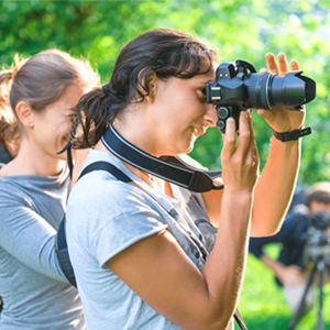young girls taking photos
