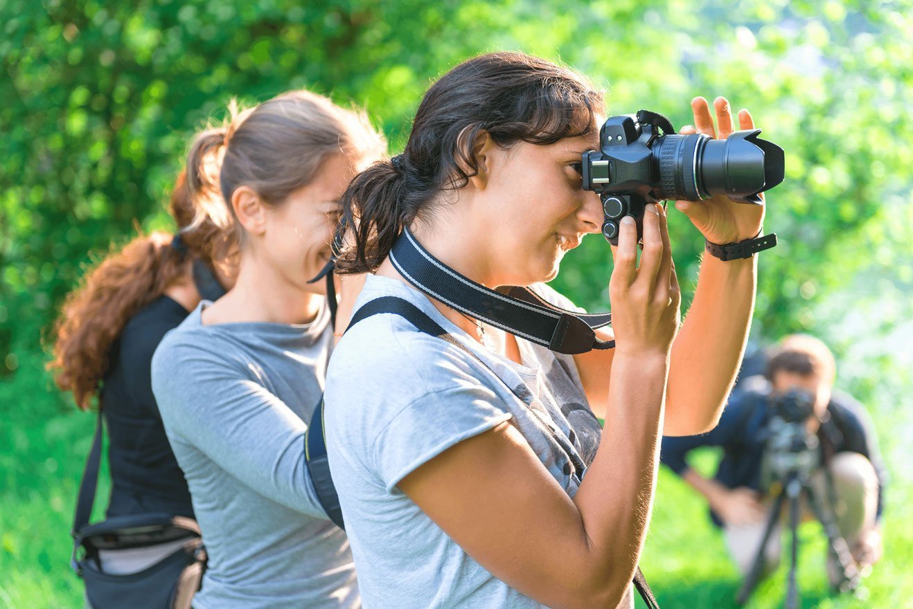 young girls taking photos